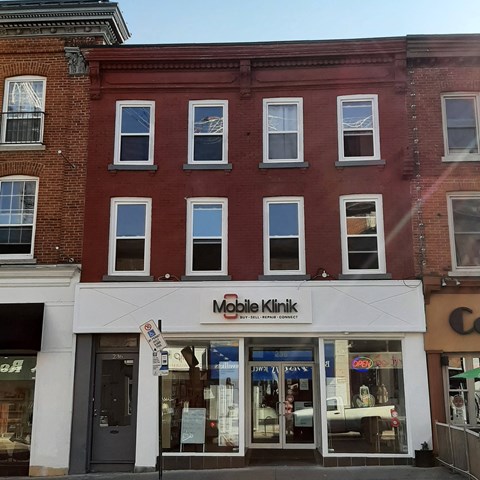 a brick building with a store in front of it